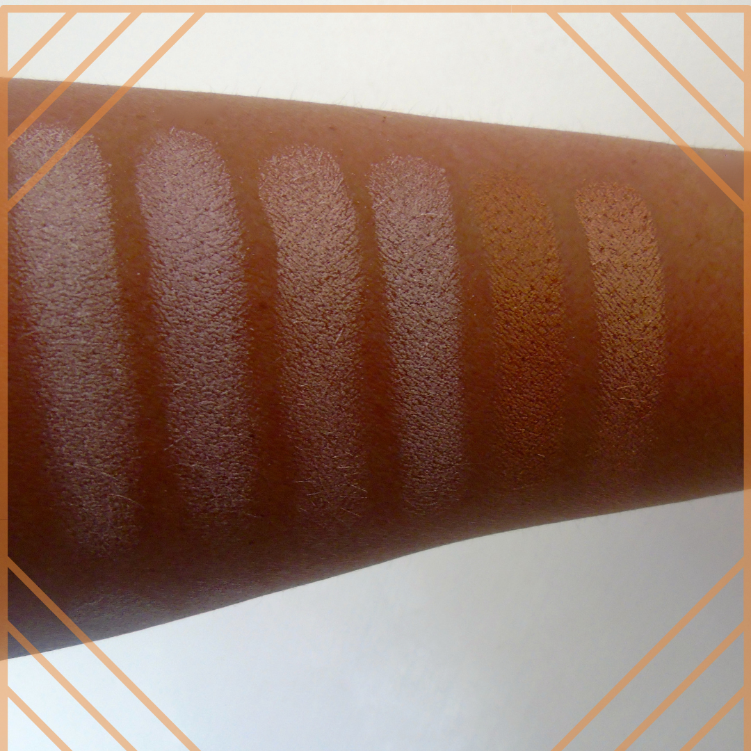 an arm showing colour swatches of a make up
