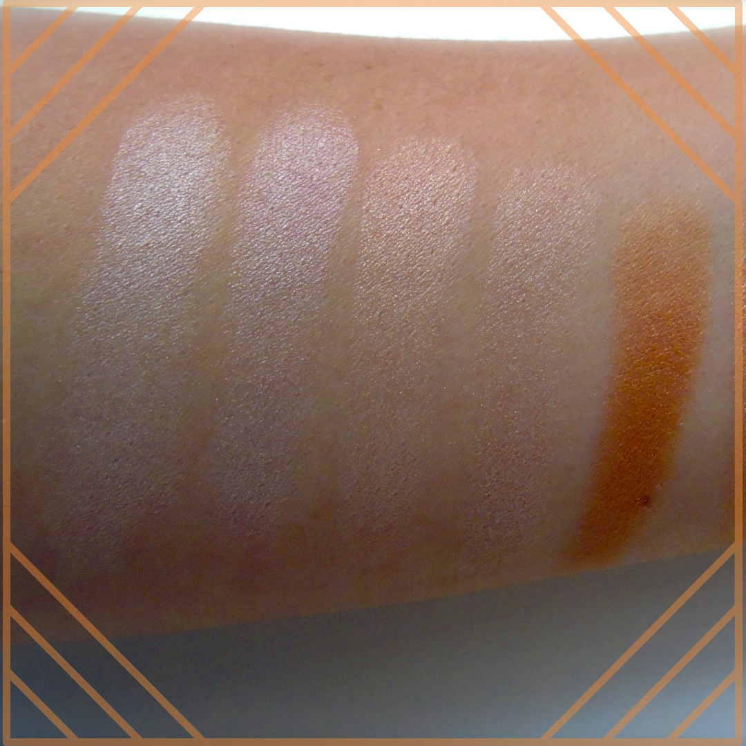 an arm showing colour swatches of make up
