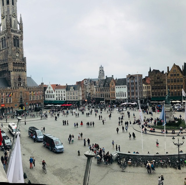 bruge market square taken from a height filled with people