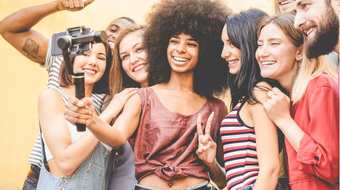 a group of micro influencers grouped together taking a selfie
