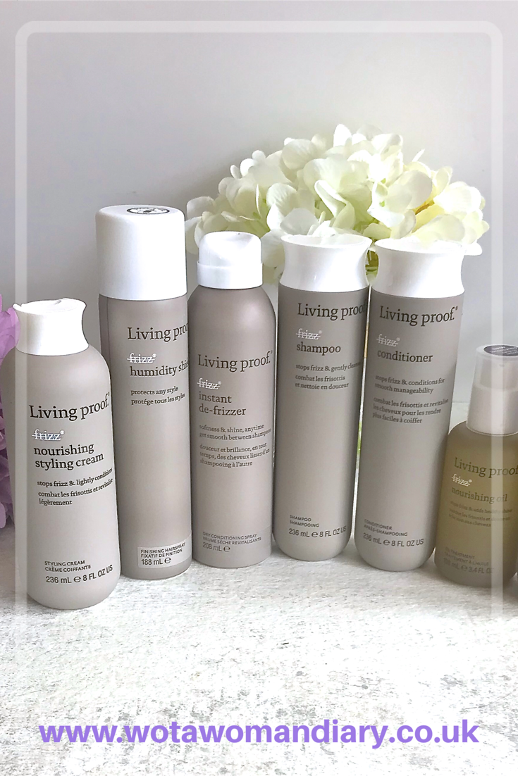 bottles of the living proof frizz free collection lined up on a side 