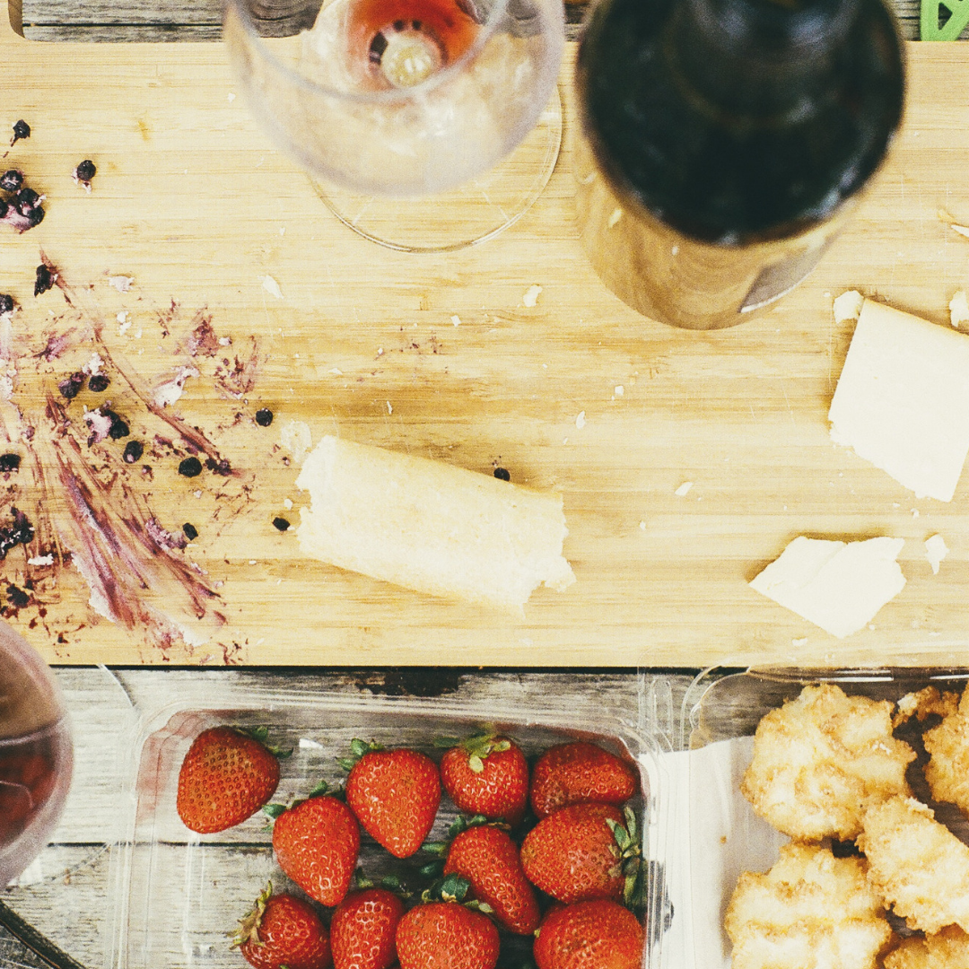 a messy worktop in a kitchen with bits of food scattered on it needing cleaning