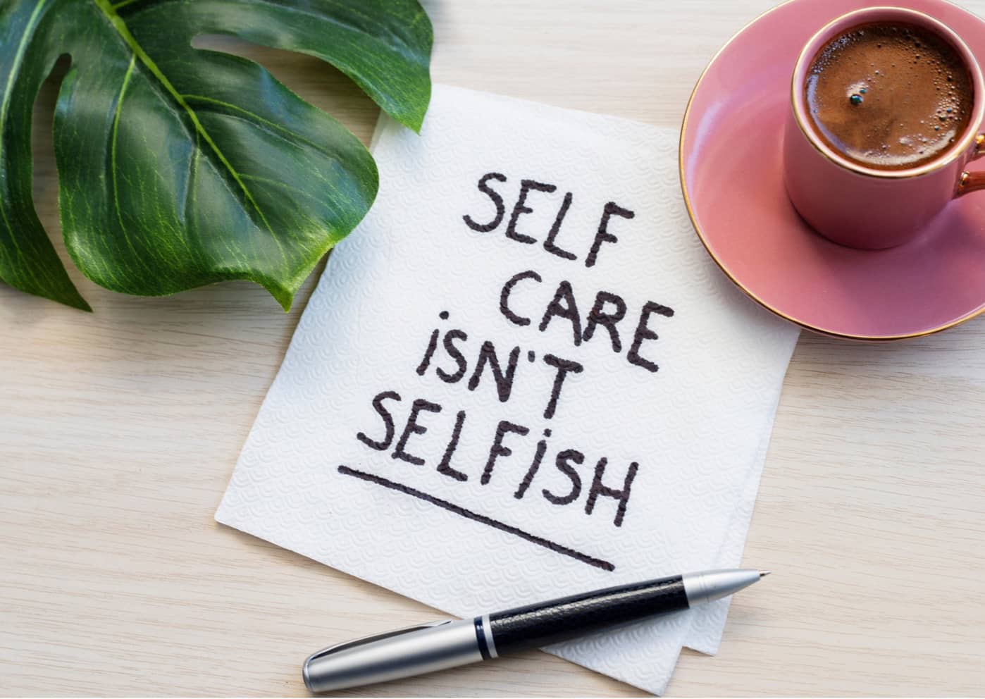 astaged banner with the words self care isn't selfish written on it