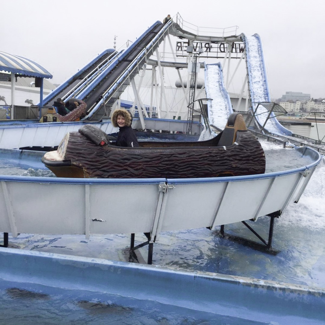 brighton pier log flume with a child sitting in the front seat