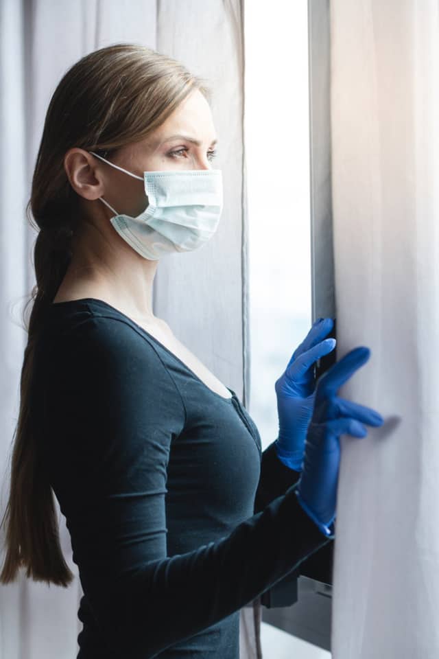 a lady in lockdown on her birthday looking out the window
