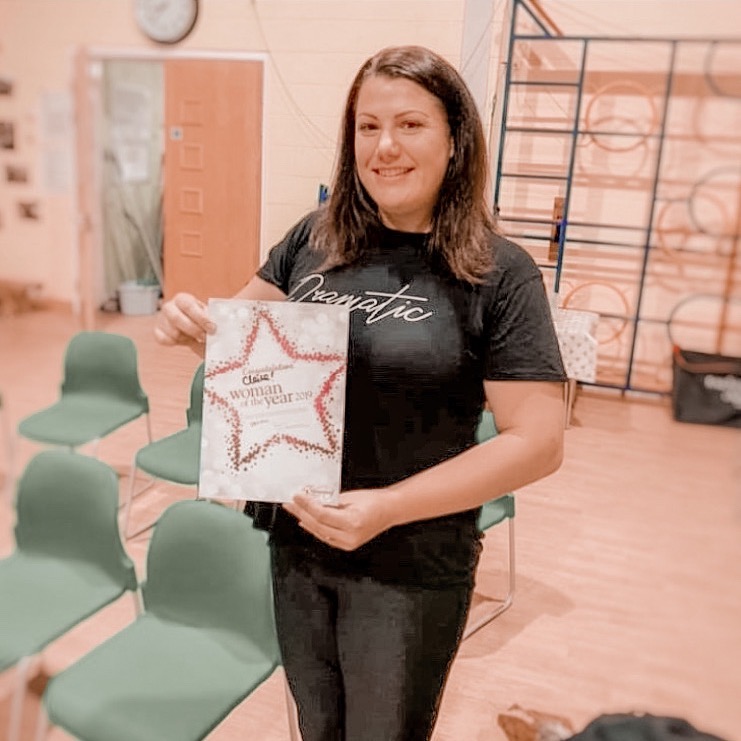 claire stewart holding a certificate
