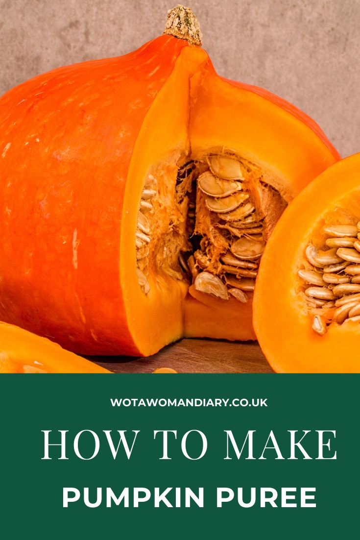 a large pumpkin which has been sliced open so you can see the fleshy insides and seeds