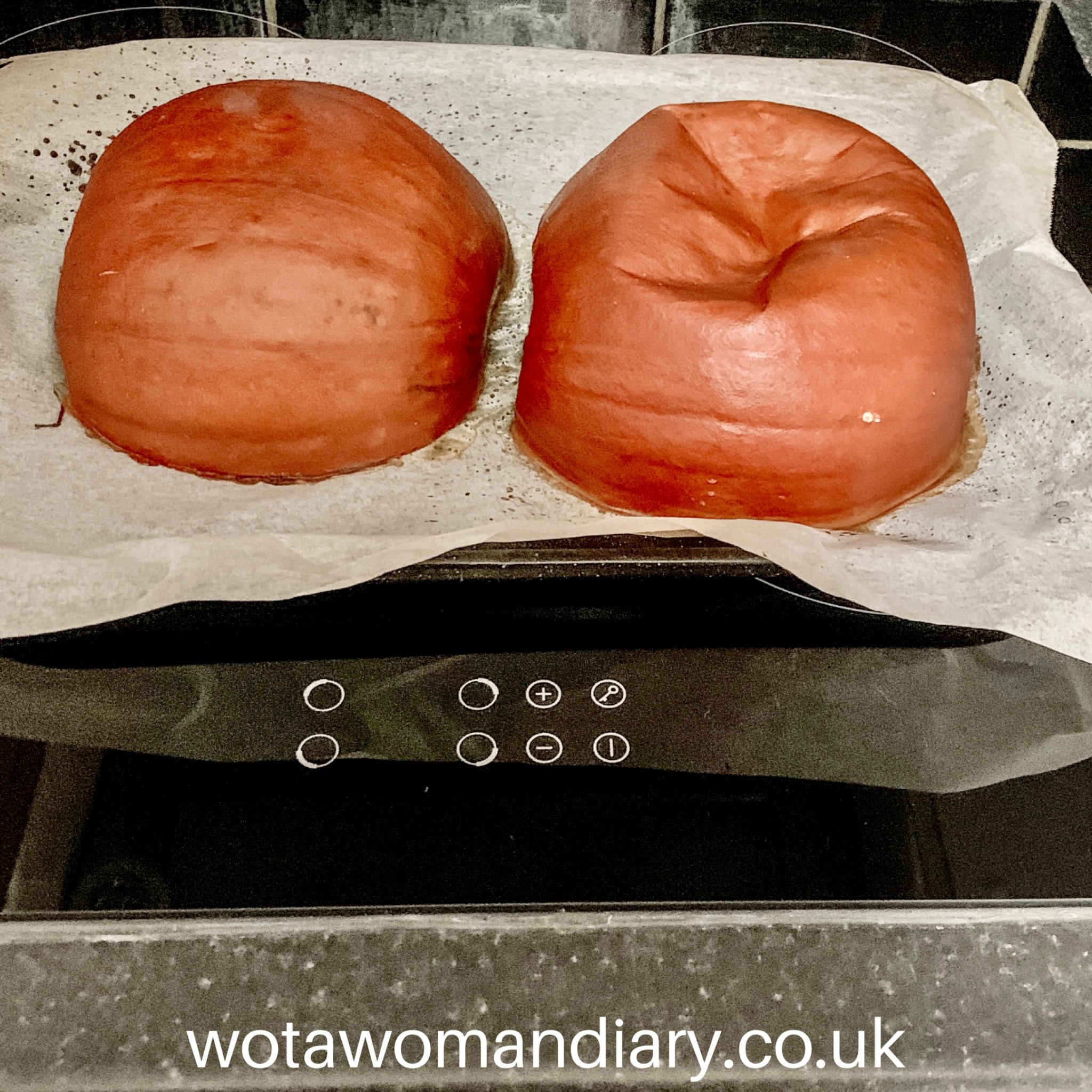a halved pumpkin which has been baked