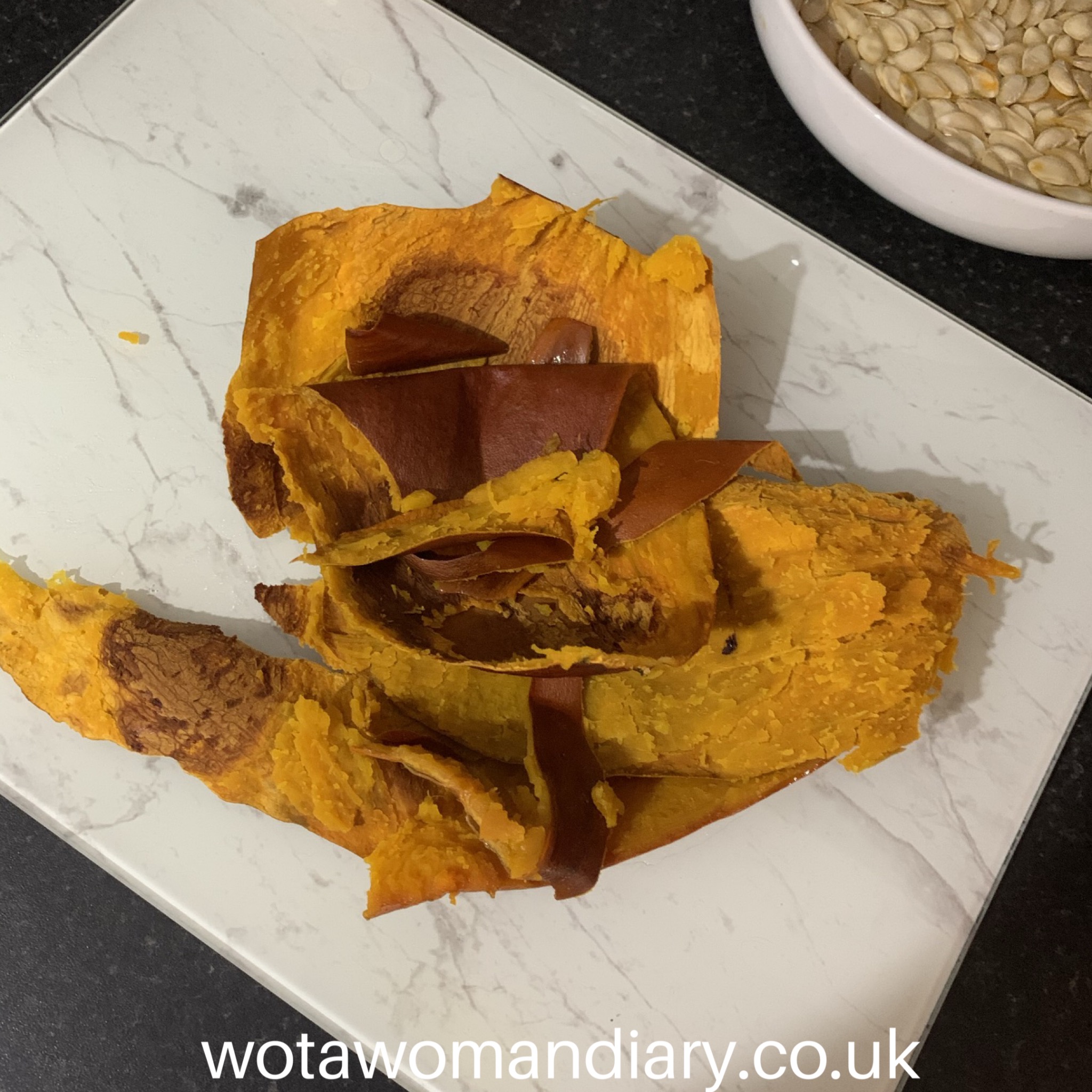 the skin off a baked pumpkin which has been peeled and left in a pile