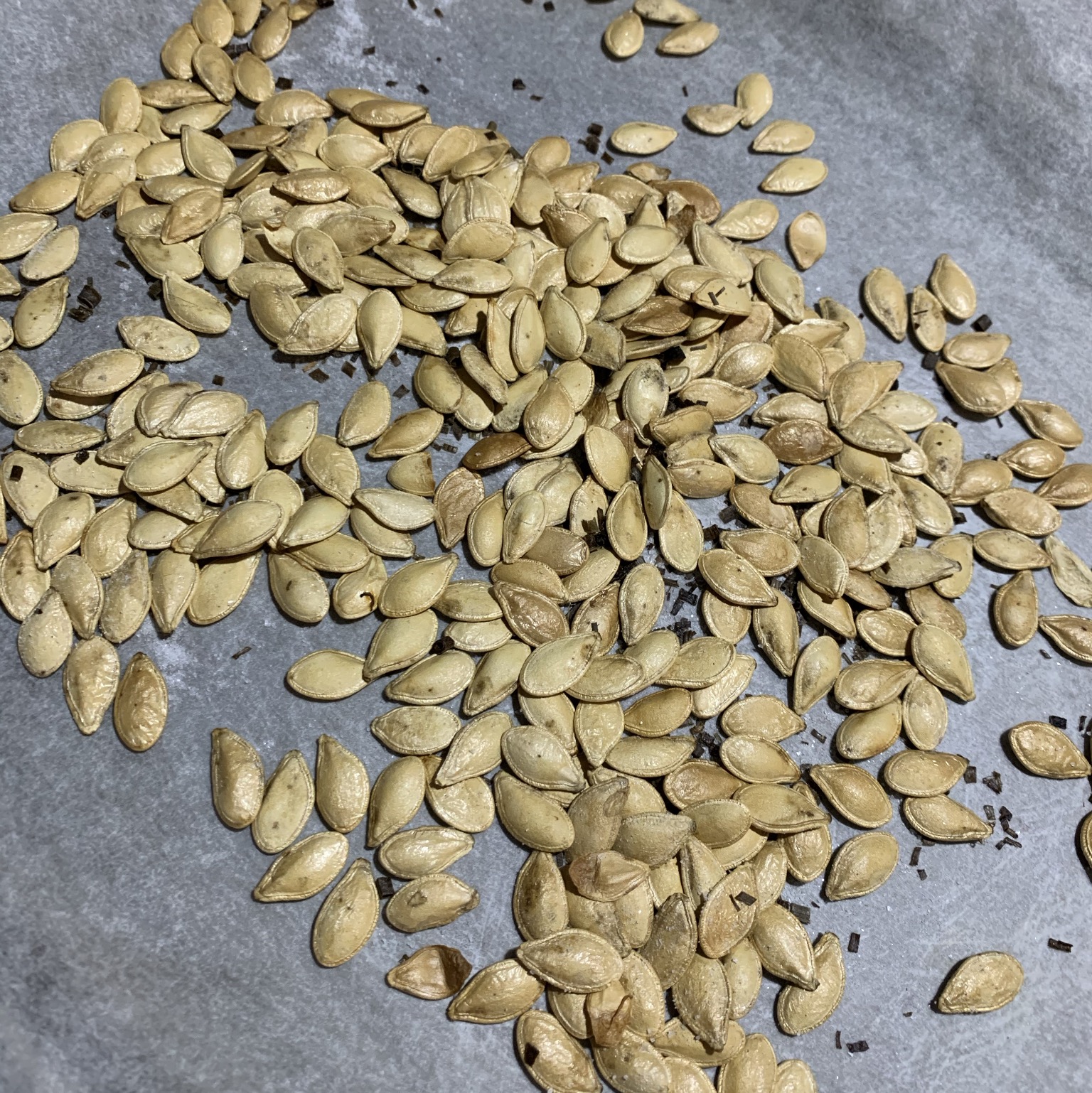 a tray of roasted pumpkin seeds ready to eat
