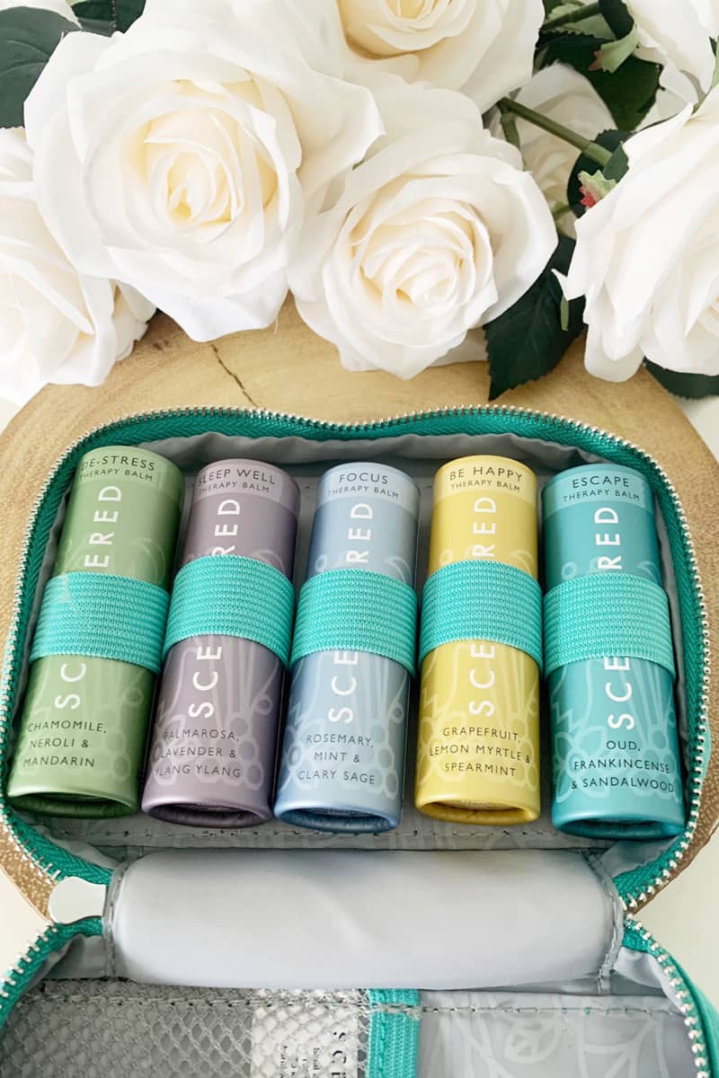 the Scentered aromatherapy balm tubes neatly lined up in the travel case