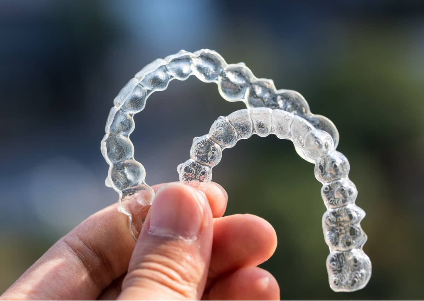 a pair of clear braces used for invisalign treatments