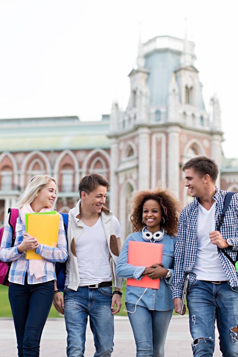 a group of 4 students heading to university
