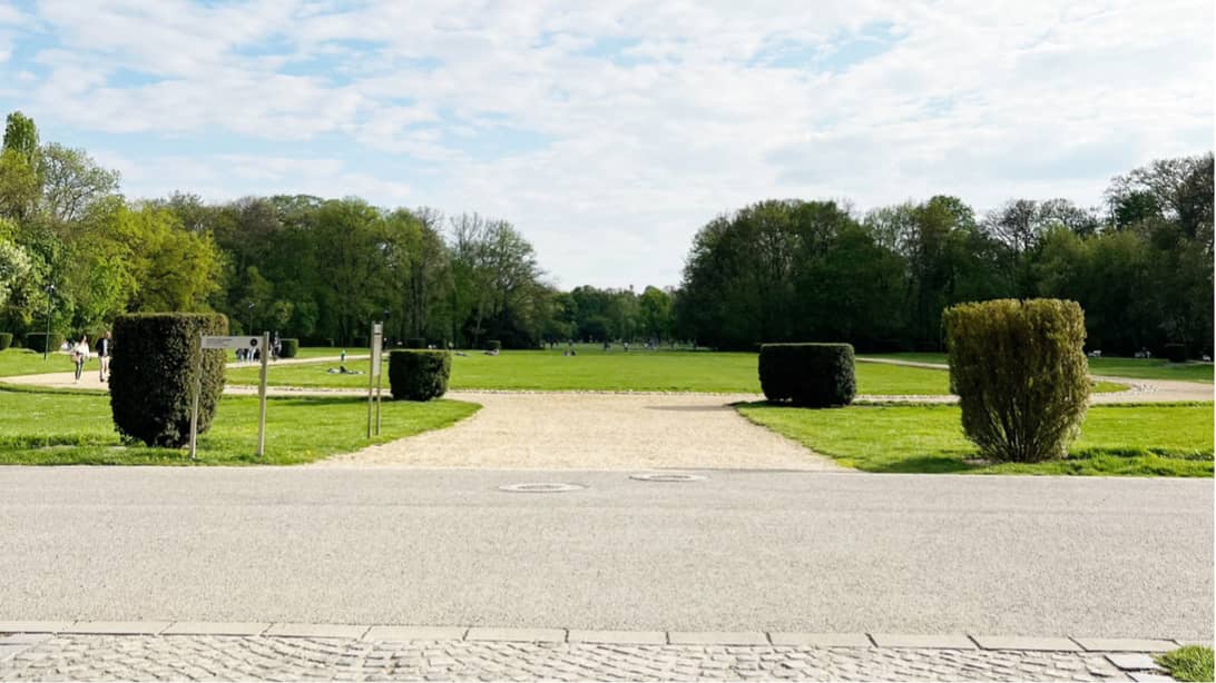 Light garden in Budapest shows picturesque landscaped lawns with well maintained hedge lines and gravel path